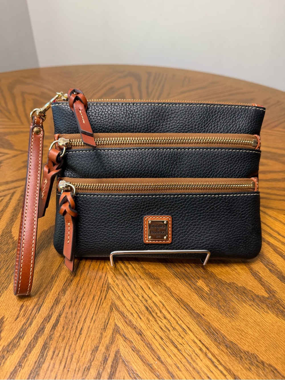 Dooney & Bourke Black Pebble Leather Triple Zip Wristlet with Brown Trim